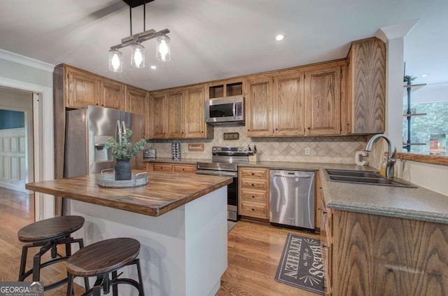 6095 Fords Rd NW, Acworth, GA 30101 - kitchen featuring appliances with stainless steel finishes, a sink, butcher block countertops, light wood-style flooring, and crown molding
