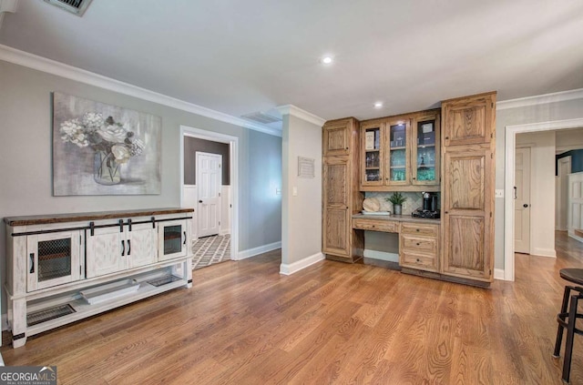 6095 Fords Rd NW, Acworth, GA 30101 - bar area featuring ornamental molding, baseboards, built in desk, wood finished floors, and recessed lighting