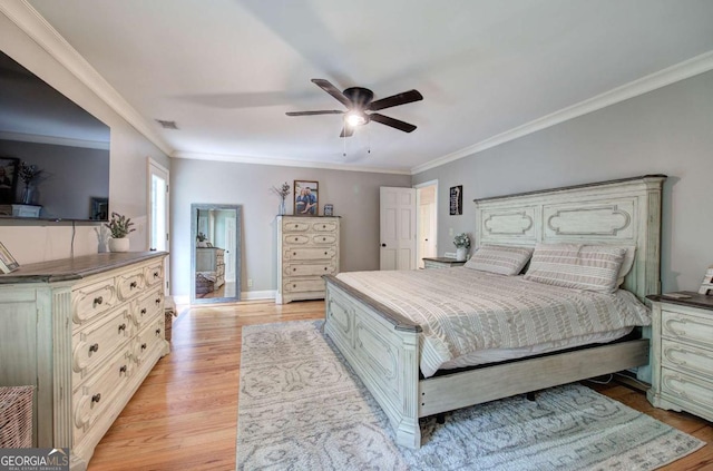 6095 Fords Rd NW, Acworth, GA 30101 - bedroom with crown molding, light wood finished floors, baseboards, and ceiling fan