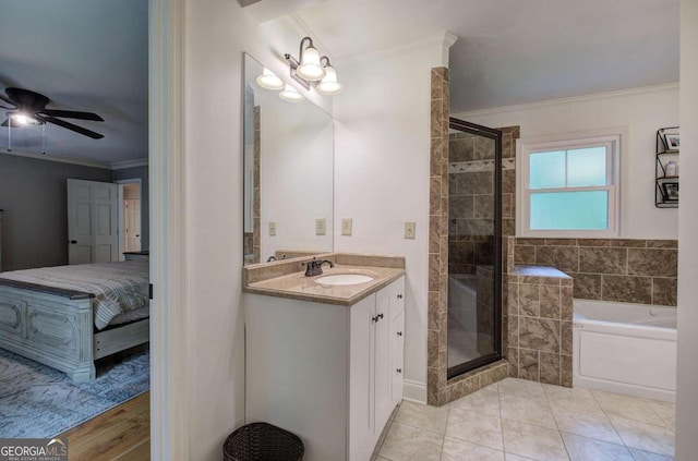 6095 Fords Rd NW, Acworth, GA 30101 - ensuite bathroom featuring crown molding, a garden tub, a stall shower, vanity, and a ceiling fan