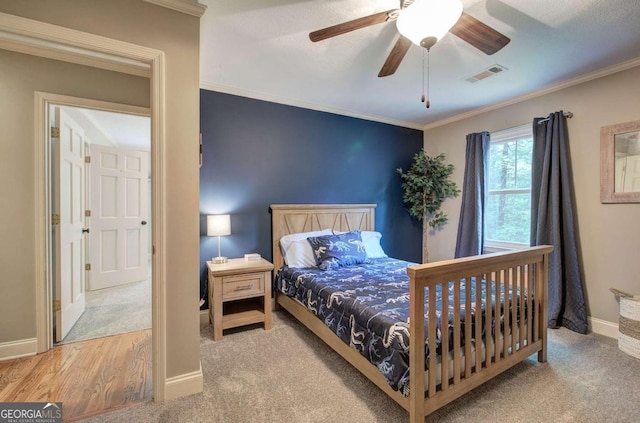 6095 Fords Rd NW, Acworth, GA 30101 - bedroom with baseboards, carpet, ornamental molding, and a ceiling fan