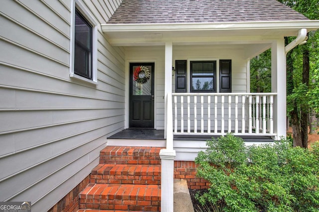 6095 Fords Rd NW, Acworth, GA 30101 - view of exterior entry featuring a shingled roof and a porch