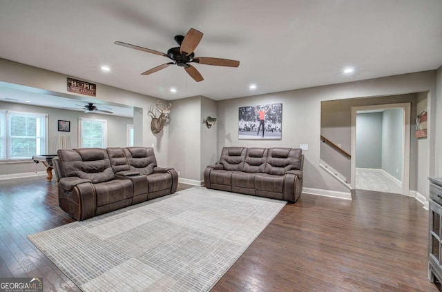 6095 Fords Rd NW, Acworth, GA 30101 - living area featuring dark wood finished floors, recessed lighting, ceiling fan, baseboards, and stairway