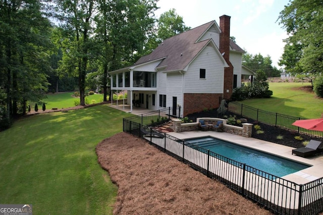 6095 Fords Rd NW, Acworth, GA 30101 - back of property with a patio, a chimney, and a sunroom