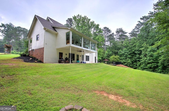 6095 Fords Rd NW, Acworth, GA 30101 - rear view of property with ceiling fan, a yard, brick siding, and a patio