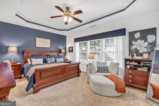 7891 Brass Lantern Dr, Flowery Branch, GA 30542 - carpeted bedroom featuring a tray ceiling, ceiling fan, and crown molding