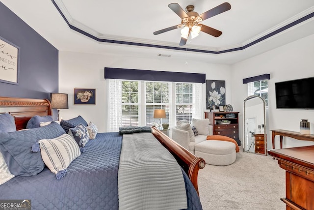 7891 Brass Lantern Dr, Flowery Branch, GA 30542 - bedroom featuring ornamental molding, carpet, a tray ceiling, and ceiling fan
