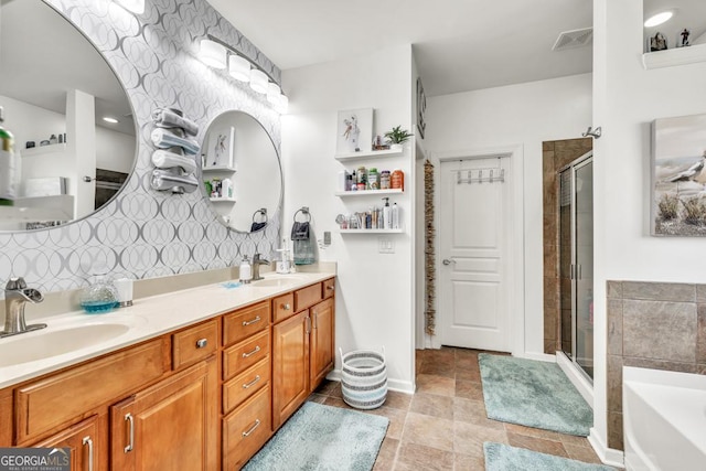 7891 Brass Lantern Dr, Flowery Branch, GA 30542 - full bath featuring a shower stall, double vanity, a bath, and tasteful backsplash