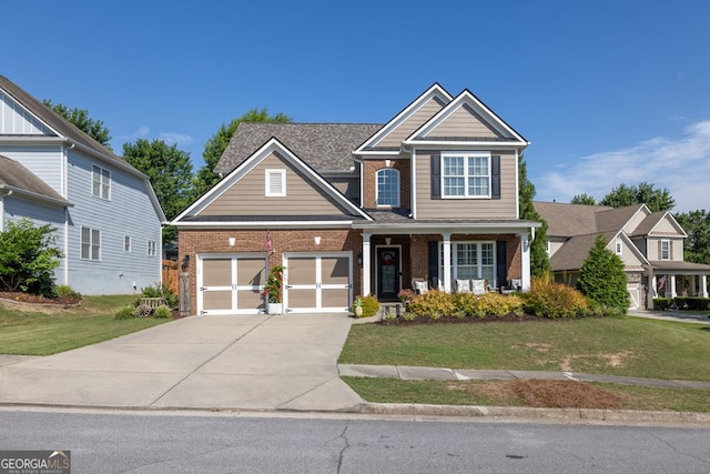 7891 Brass Lantern Dr, Flowery Branch, GA 30542 - view of front of home featuring brick siding, concrete driveway, and a front lawn