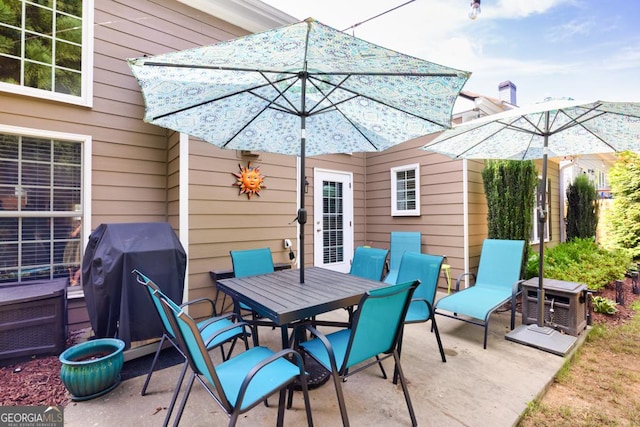 7891 Brass Lantern Dr, Flowery Branch, GA 30542 - view of patio / terrace with a grill and outdoor dining area