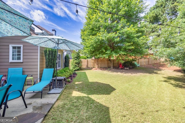 7891 Brass Lantern Dr, Flowery Branch, GA 30542 - fenced backyard featuring a patio