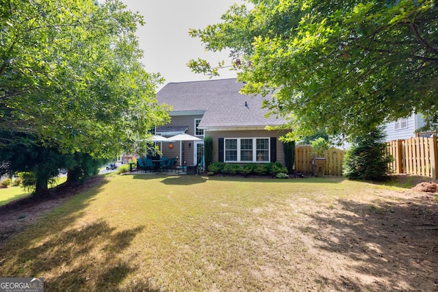 7891 Brass Lantern Dr, Flowery Branch, GA 30542 - back of house featuring a patio area and a shingled roof