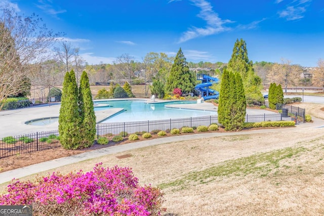 7891 Brass Lantern Dr, Flowery Branch, GA 30542 - community pool featuring a water slide