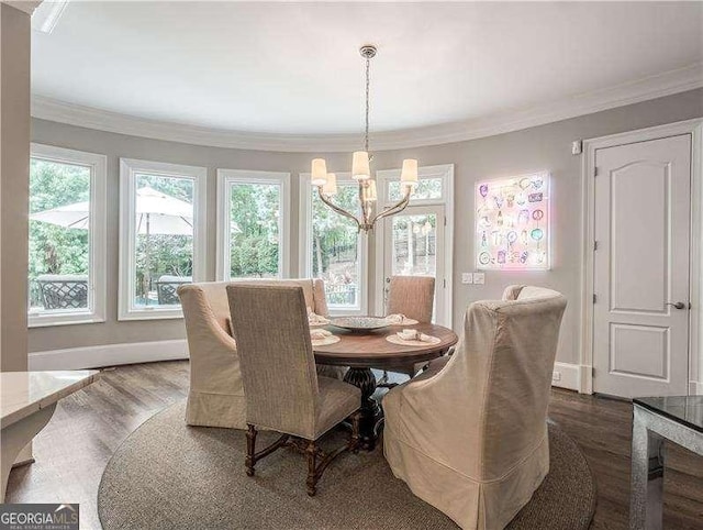 8957 Old Southwick Pass, Johns Creek, GA 30022 - dining area with a chandelier, wood finished floors, crown molding, and baseboards