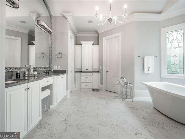 8957 Old Southwick Pass, Johns Creek, GA 30022 - full bath featuring ornamental molding, a freestanding tub, vanity, a chandelier, and marble finish flooring