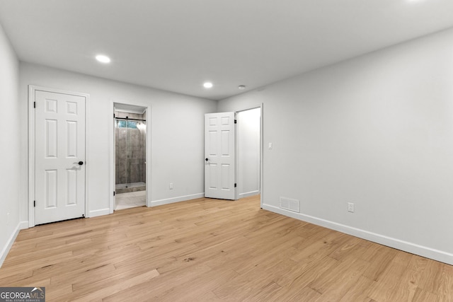 130 Redbud Ct, Senoia, GA 30276 - unfurnished bedroom with light wood-style floors, baseboards, recessed lighting, and ensuite bath