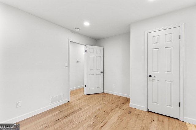 130 Redbud Ct, Senoia, GA 30276 - unfurnished bedroom featuring light wood-style flooring, baseboards, and recessed lighting