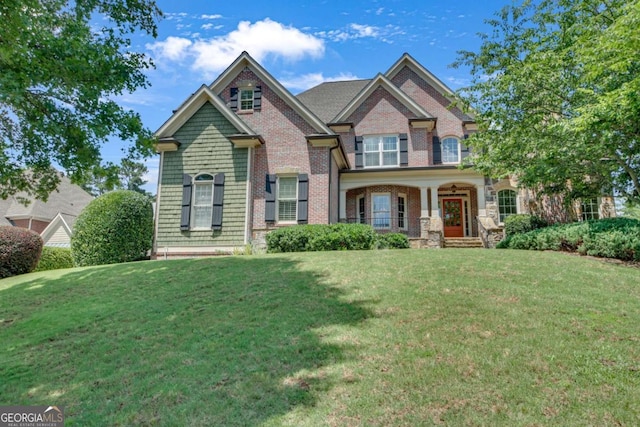 3451 Falls Branch Ct, Buford, GA 30519 - craftsman inspired home with a front yard and brick siding