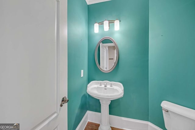 3451 Falls Branch Ct, Buford, GA 30519 - bathroom featuring baseboards and toilet