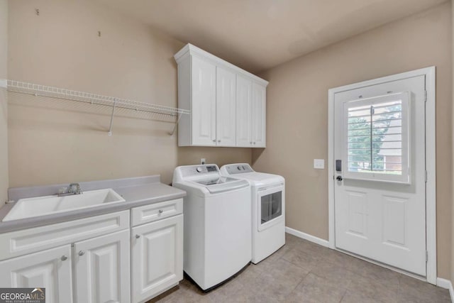 3451 Falls Branch Ct, Buford, GA 30519 - laundry room with separate washer and dryer, cabinet space, baseboards, and light tile patterned floors