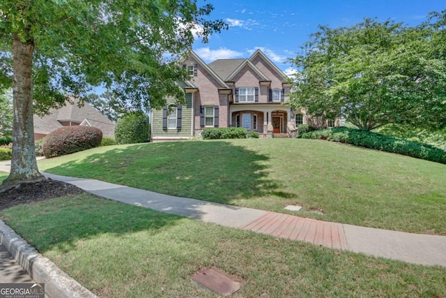 3451 Falls Branch Ct, Buford, GA 30519 - view of front facade with a front yard and brick siding