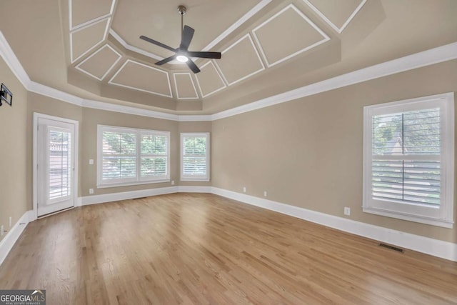 3451 Falls Branch Ct, Buford, GA 30519 - empty room featuring a ceiling fan, healthy amount of natural light, crown molding, wood finished floors, and baseboards