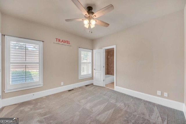 3451 Falls Branch Ct, Buford, GA 30519 - spare room featuring carpet, baseboards, and ceiling fan