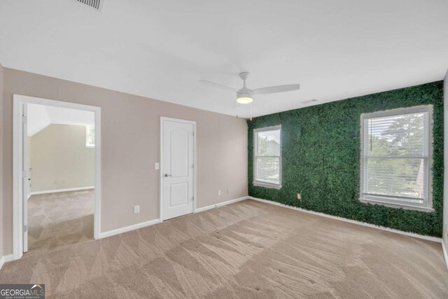 3451 Falls Branch Ct, Buford, GA 30519 - unfurnished bedroom with carpet flooring, multiple windows, and baseboards