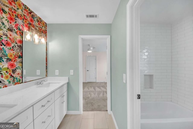 3451 Falls Branch Ct, Buford, GA 30519 - bathroom with double vanity, baseboards, tile patterned flooring, and washtub / shower combination