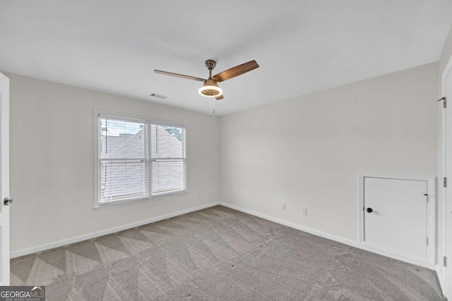 3451 Falls Branch Ct, Buford, GA 30519 - carpeted spare room featuring a ceiling fan and baseboards