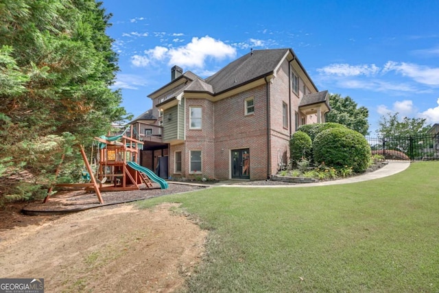 3451 Falls Branch Ct, Buford, GA 30519 - rear view of house featuring brick siding and a chimney