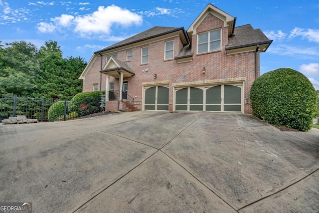 3451 Falls Branch Ct, Buford, GA 30519 - view of front of house with concrete driveway, brick siding, and a garage