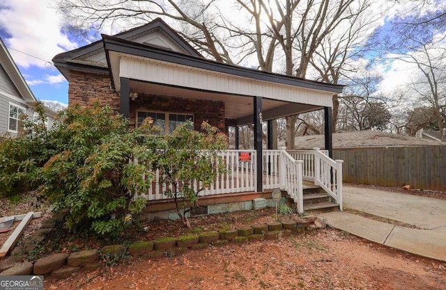 1852 E Farris Ave, Atlanta, GA 30344 - view of front facade featuring stone siding and a porch