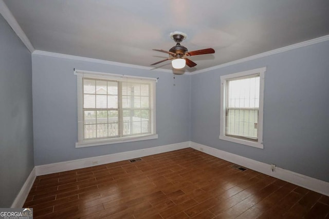 1852 E Farris Ave, Atlanta, GA 30344 - empty room with baseboards, healthy amount of natural light, ceiling fan, ornamental molding, and dark wood-type flooring