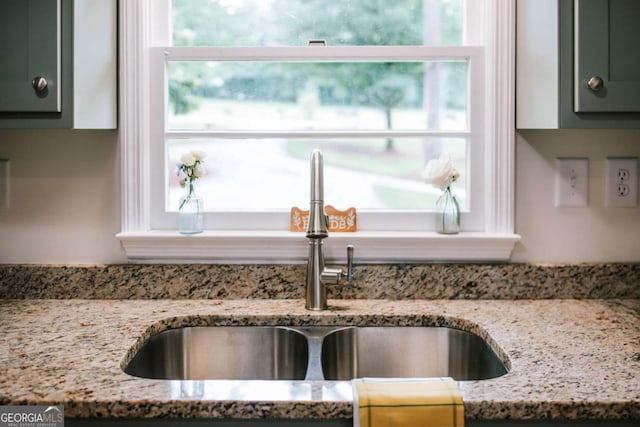 764 Sandy Cross Rd, Lexington, GA 30648 - kitchen view of a sink, light stone countertops, and green cabinets