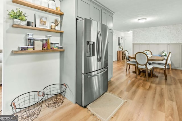 764 Sandy Cross Rd, Lexington, GA 30648 - kitchen featuring stainless steel fridge, light wood-style floors, and open shelves