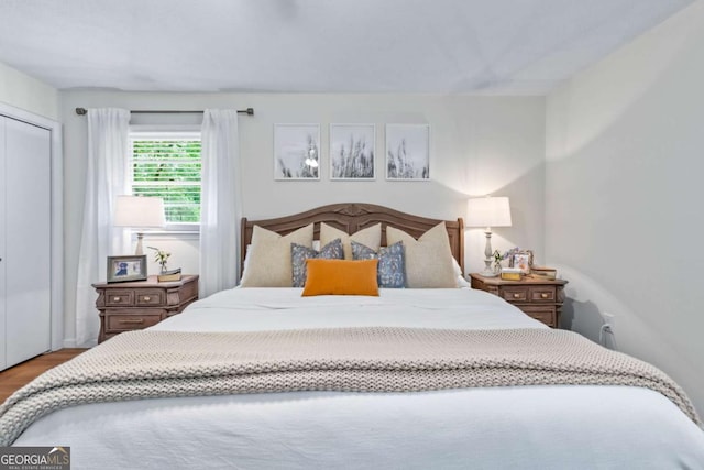 764 Sandy Cross Rd, Lexington, GA 30648 - bedroom featuring wood finished floors and a closet