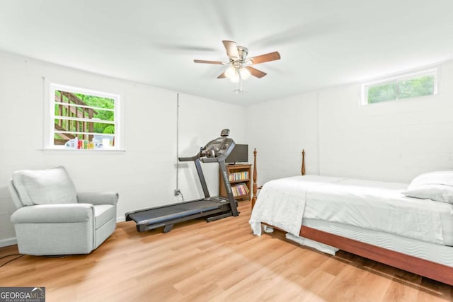 764 Sandy Cross Rd, Lexington, GA 30648 - bedroom with wood finished floors, concrete block wall, and a ceiling fan