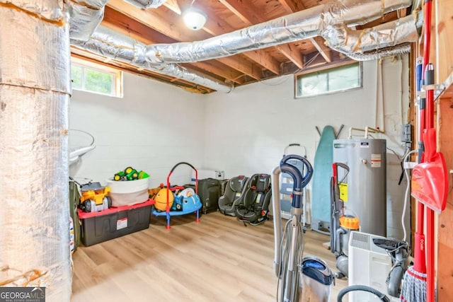 764 Sandy Cross Rd, Lexington, GA 30648 - basement featuring water heater, wood finished floors, and concrete block wall