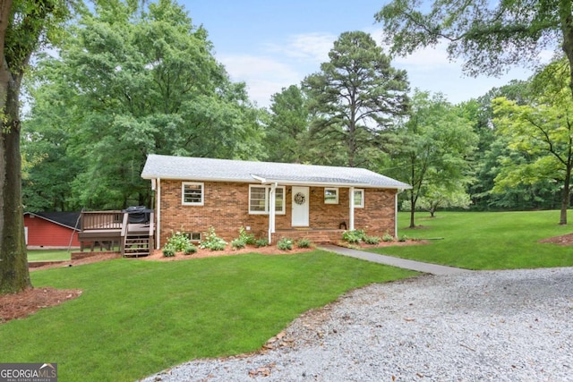 764 Sandy Cross Rd, Lexington, GA 30648 - single story home with a front yard, a wooden deck, and brick siding