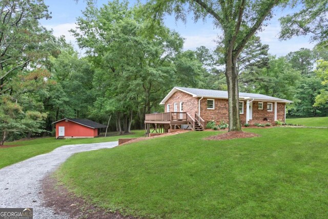 764 Sandy Cross Rd, Lexington, GA 30648 - view of grassy yard featuring a deck and driveway