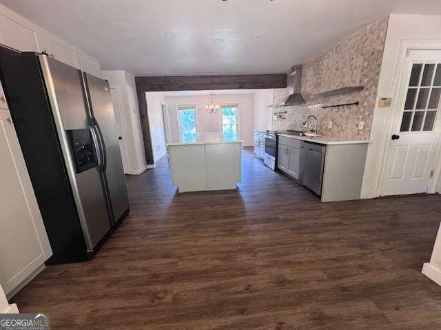 2000 Brickton Sta, Buford, GA 30518 - kitchen with stainless steel appliances, wall chimney range hood, a chandelier, dark wood finished floors, and light countertops