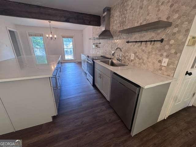2000 Brickton Sta, Buford, GA 30518 - kitchen featuring stainless steel appliances, a sink, dark wood finished floors, wall chimney exhaust hood, and a chandelier
