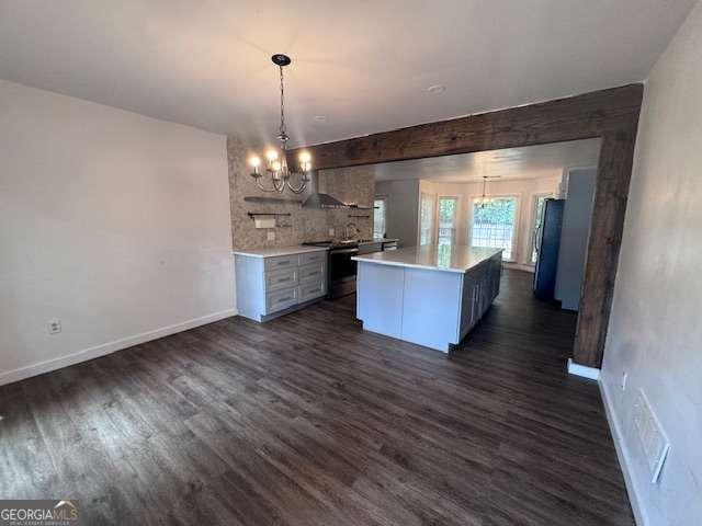2000 Brickton Sta, Buford, GA 30518 - kitchen featuring a chandelier, exhaust hood, light countertops, and dark wood-style flooring