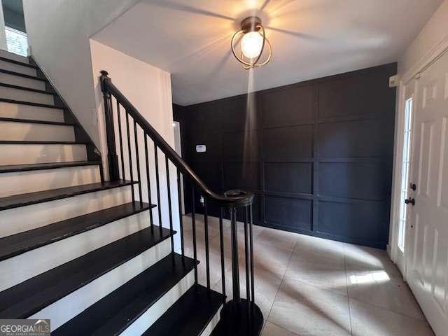 2000 Brickton Sta, Buford, GA 30518 - staircase with a decorative wall and tile patterned floors