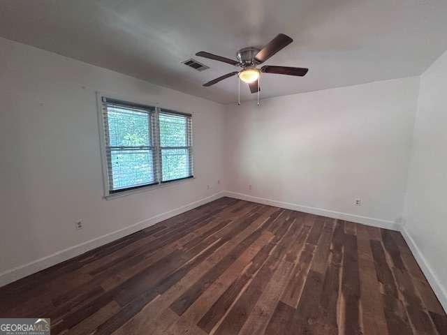 2000 Brickton Sta, Buford, GA 30518 - spare room featuring dark wood-style floors, baseboards, and a ceiling fan