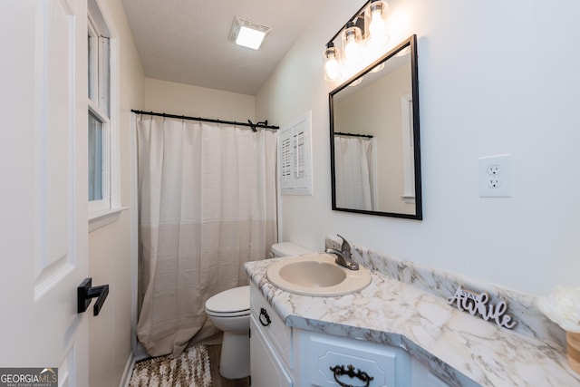 139 Old Oak Rd, Byron, GA 31008 - full bathroom featuring toilet, vanity, and a textured ceiling