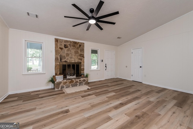 139 Old Oak Rd, Byron, GA 31008 - unfurnished living room featuring a ceiling fan, wood finished floors, a fireplace, lofted ceiling, and baseboards