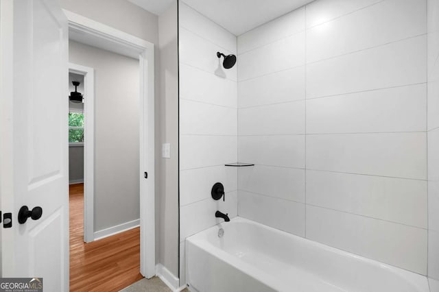 162 Langston Rd NE, Calhoun, GA 30701 - bathroom featuring wood finished floors, baseboards, and washtub / shower combination