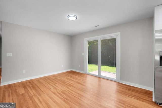 162 Langston Rd NE, Calhoun, GA 30701 - spare room with light wood-style floors and baseboards